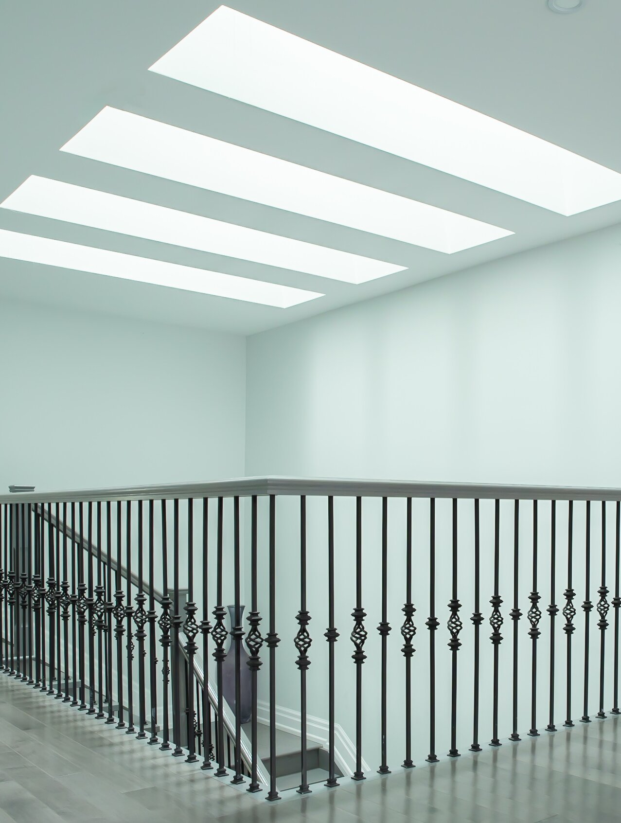 Featured central skylight well.